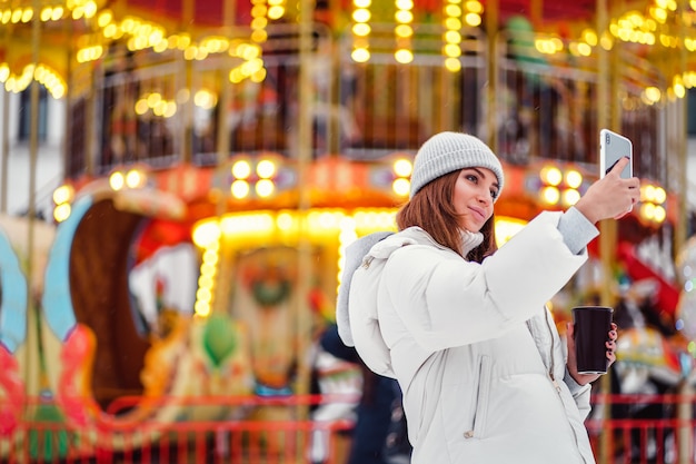 A beautiful young woman doing selfie during Christmas holidays