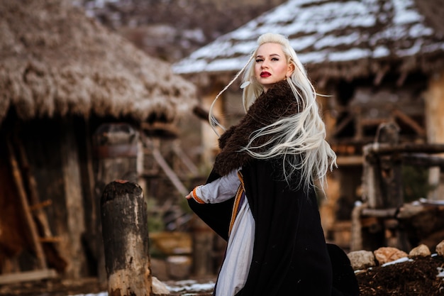 Beautiful young woman dressed in viking clothes