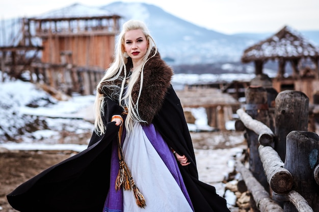 Beautiful young woman dressed in viking clothes