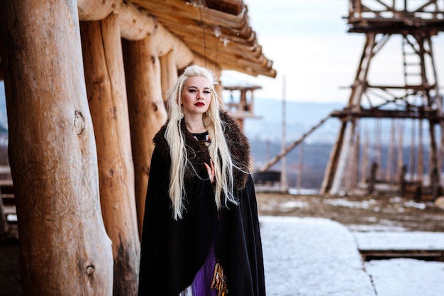 Beautiful young woman dressed in viking clothes