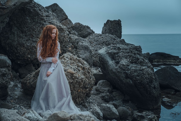 Beautiful young woman in an elegant dress