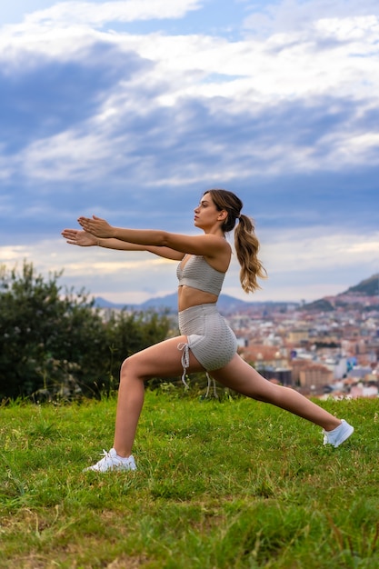 Beautiful young woman exercising nature