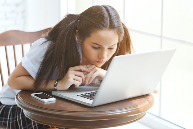 beautiful young woman hands using laptop 