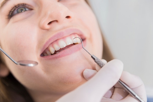 Beautiful young woman having dental check up