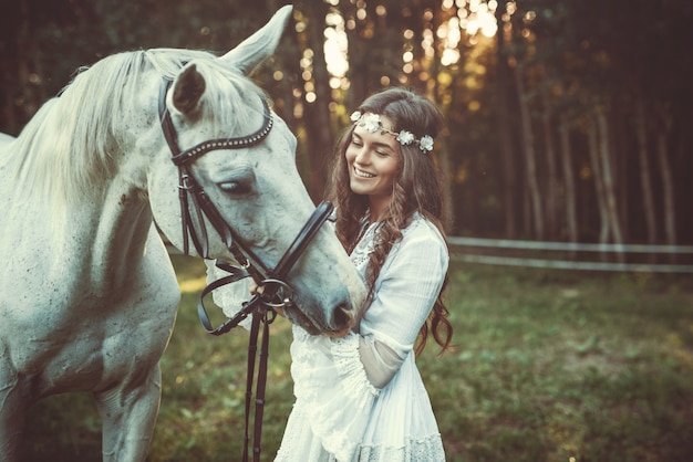 Beautiful young woman and horse