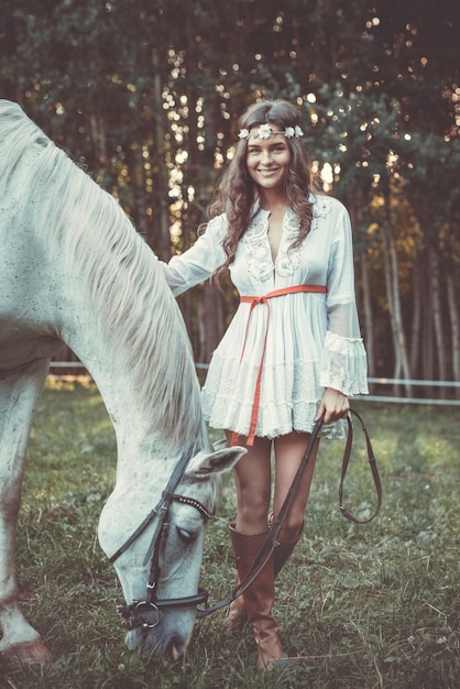 Beautiful young woman and horse