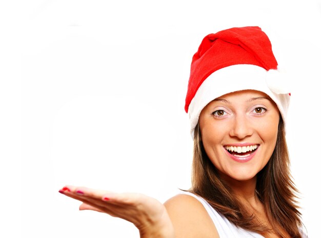 a beautiful young woman in Santa's hat over white background