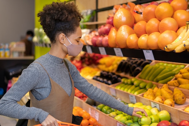 Beautiful young woman shopping for food