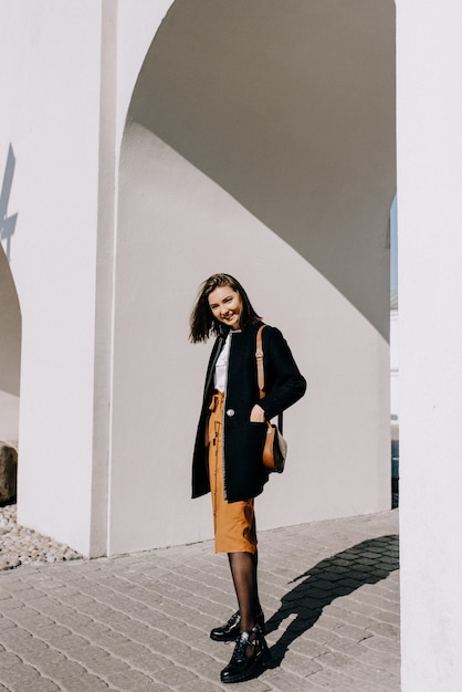 Beautiful young woman smiling. Walking in the city