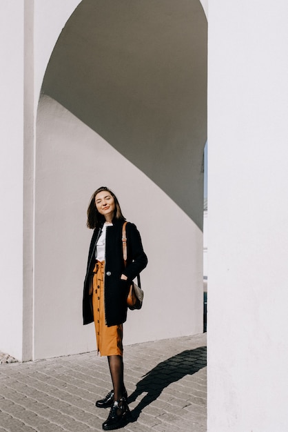 Beautiful young woman smiling. Walking in the city