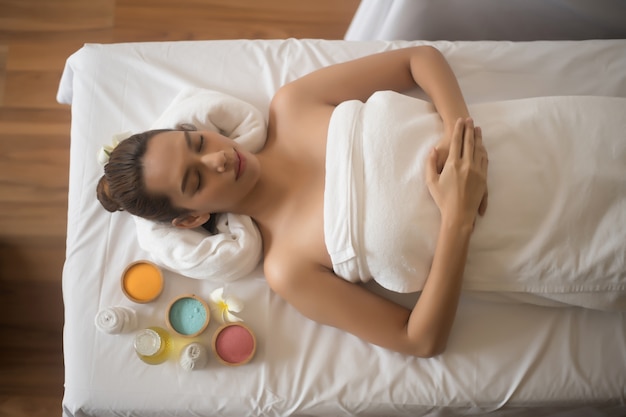 Beautiful young woman in spa salon