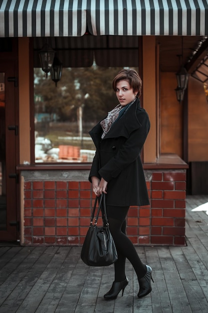 Beautiful young woman walking on the street