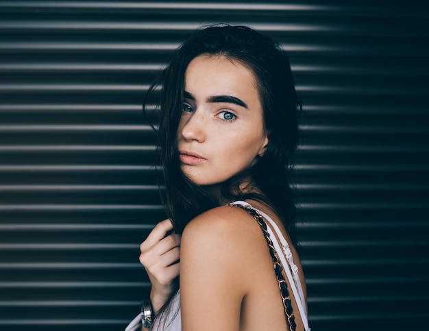 Beautiful young woman wearing a white top