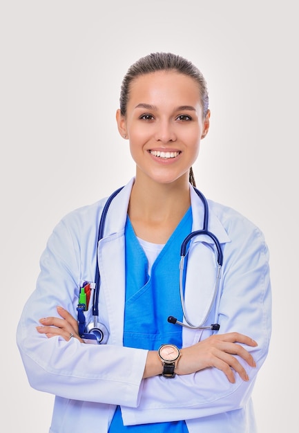 Beautiful young woman in white coat posing with hand in pocket Woman doctor