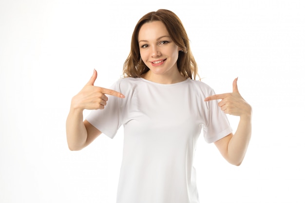 Beautiful young woman in white t-shirt with hand gesture