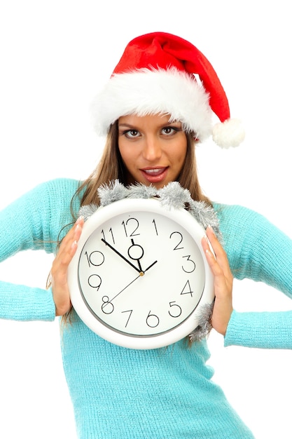 Beautiful young woman with clock, isolated on white