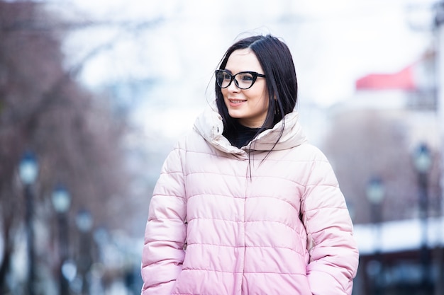 Beautiful  young woman with fashionable winter warm jacket