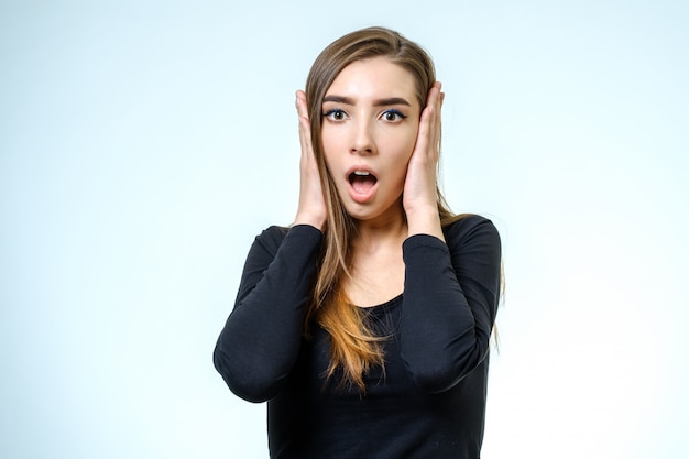 Beautiful young woman with a fear expression