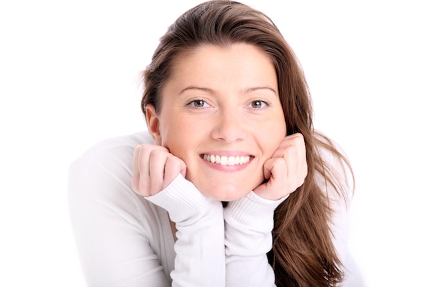 a beautiful young woman with long hair smiling over white background