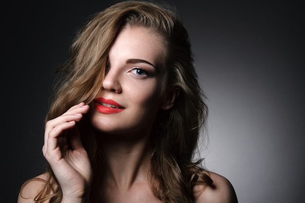 Beautiful young woman with red lips