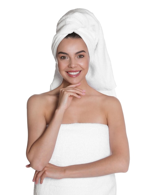 Beautiful young woman with towels on white background