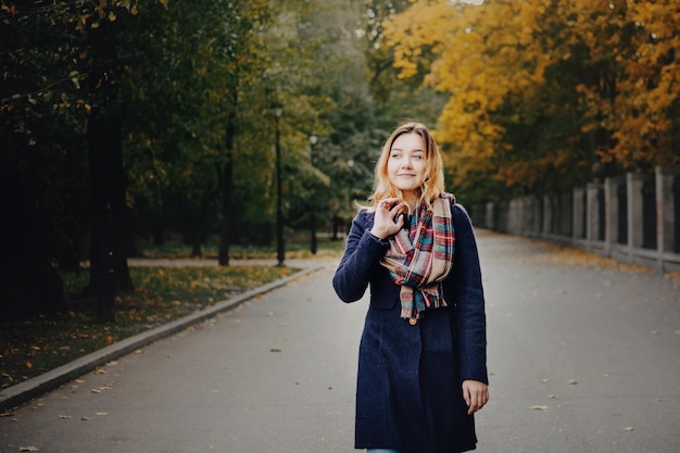 Beautiful young women in the autumn park