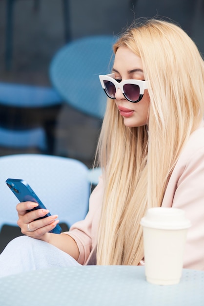 Beautiful young women drinking coffee in restaurant.