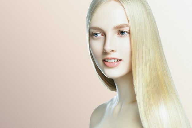 Beautifulhairwoman blonde hairstyle model long hair healthy skin. Studio shot.