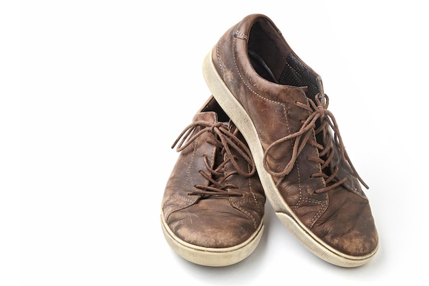 Beautifully aged vintage brown leather boots isolated on white background Front view