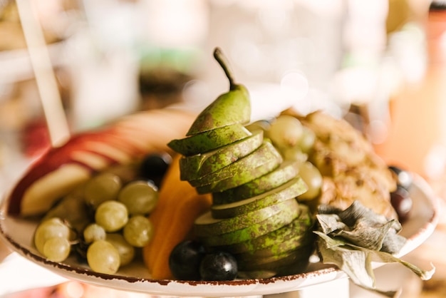 Beautifully decorated catering banquet table with different food snacks and appetizers with sandwich fresh fruits on corporate party event or wedding celebration