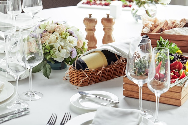 Beautifully decorated catering banquet table with different food snacks and appetizers.