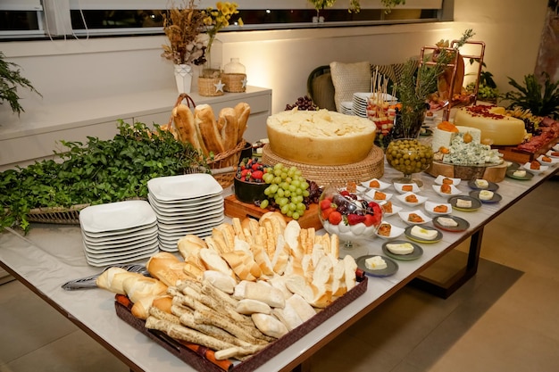 Beautifully decorated food table for events with cheese and lamb carret.