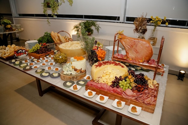 Beautifully decorated food table for events with cheese and lamb carret.