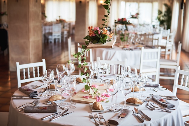 Beautifully decorated tables for guests with decorations in a restaurant. 