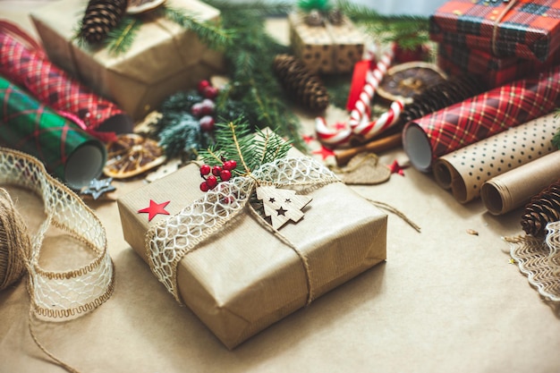 Beautifully designed christmas gift the table is covered with beige craft paper and filled with