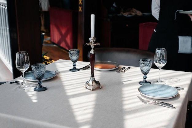 A beautifully laid table with exquisite dishes in a modern restaurant