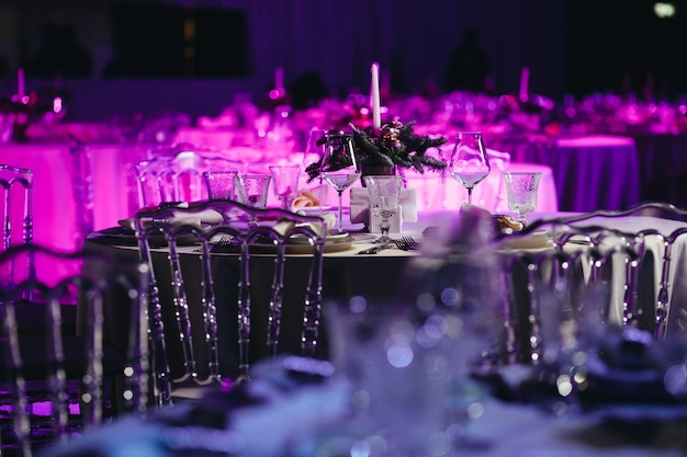 Beautifully organized event round served table banquet ready for guests round decorated table with empty plate glasses forks napkin Elegant dinner table