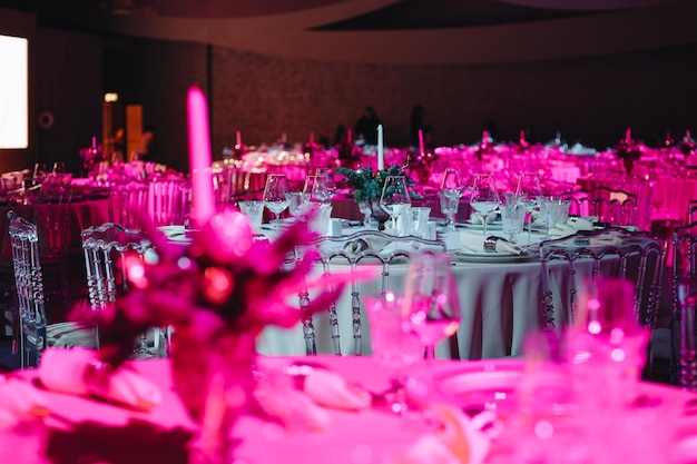 Beautifully organized event round served table banquet ready for guests round decorated table with empty plate glasses forks napkin Elegant dinner table