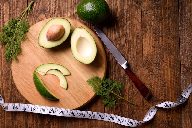 Beautifully plated avocado toast with delicious-looking toppings on wooden brown table. 