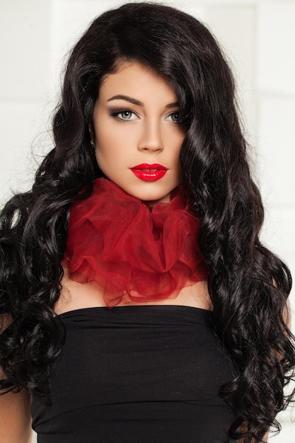 Beauty Brunette Woman Elegant Fashion Lady with Makeup and Long Curly Hairdo