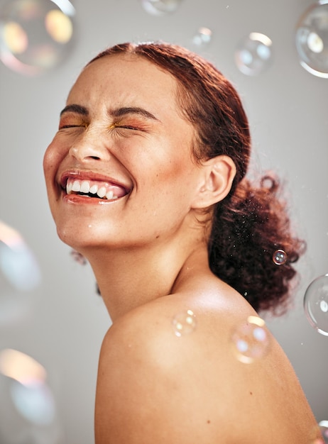 Beauty bubble and a happy woman in studio for skincare cosmetics natural skin glow and dermatology Facial makeup health and wellness of aesthetic model person with luxury body product and peace