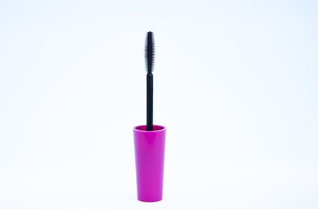 Beauty concept Brush for applying mascara on eyelashes Makeup beauty product Mascara add volume and length to natural eyelashes Mascara plastic brush Black mascara brush white background