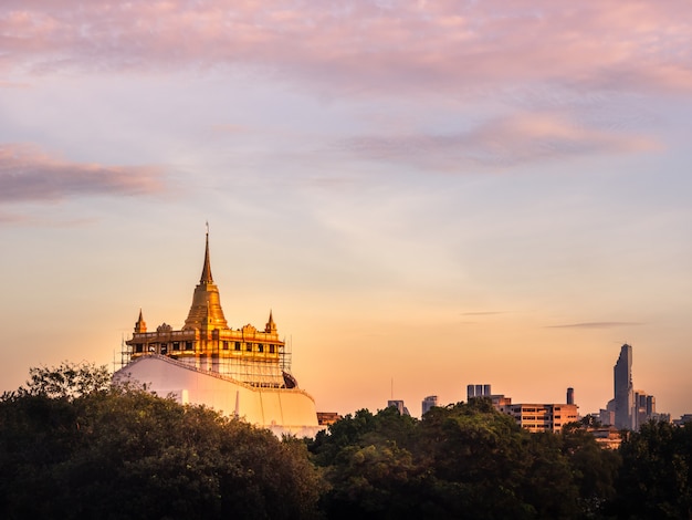 Beauty the evening sun setting. The pagoda or Chedi Phukhao Thong [ Golden Mount ] ,Thaila