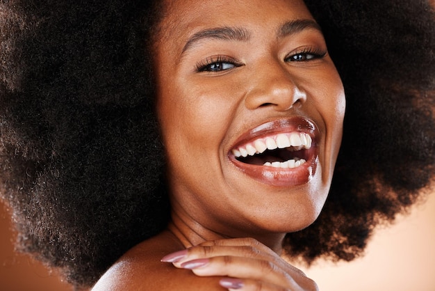 Beauty face and black woman with makeup and natural cosmetics portrait afro and skincare closeup against studio background Happy model cosmetic advertising and hair care facial and healthy skin