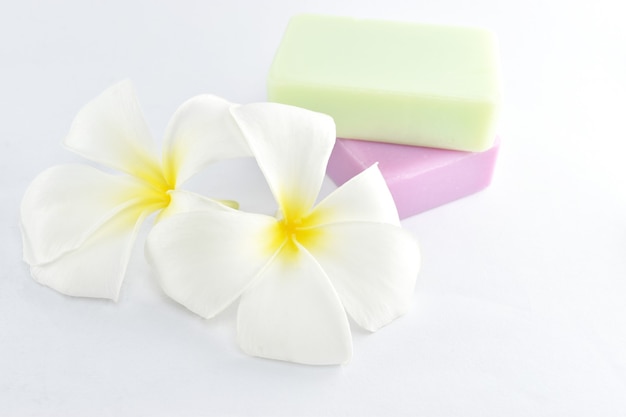 Beauty and fashion concept natural soap and plumeria on white background