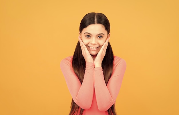 Beauty and fashion female fashion model cute look of young teen girl on yellow background