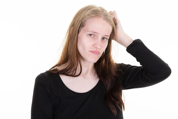 Beauty girl blonde pensive doubt portrait of confident young woman hand finger on hair