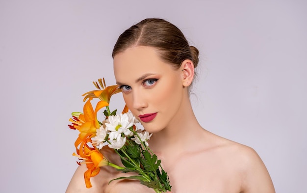 Beauty and make up fashion model portrait with blossom flowers