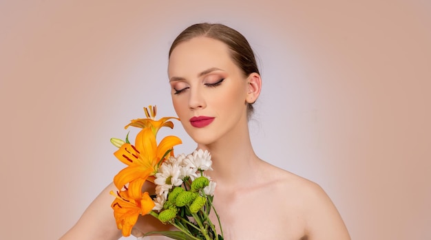 Beauty and make up fashion model portrait with blossom flowers