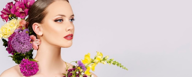 Beauty and make up fashion model portrait with blossom flowers